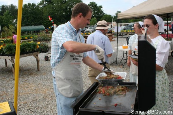 Marlin Cooking the Toppings on the BBQ26S Griddle